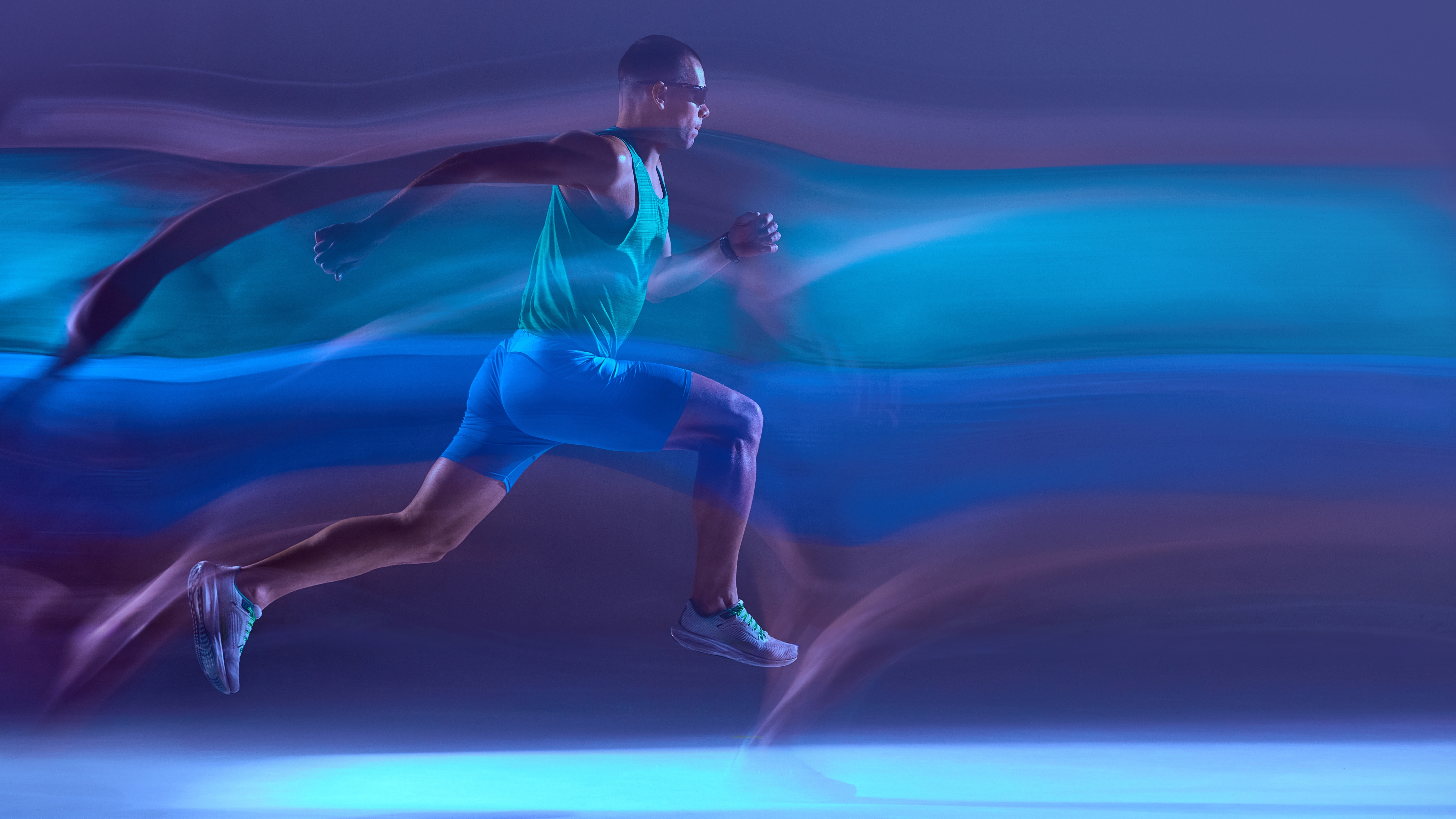 Runner,Captured,Mid-stride,In,Neon,Lighting,With,Dynamic,Motion,Trails.