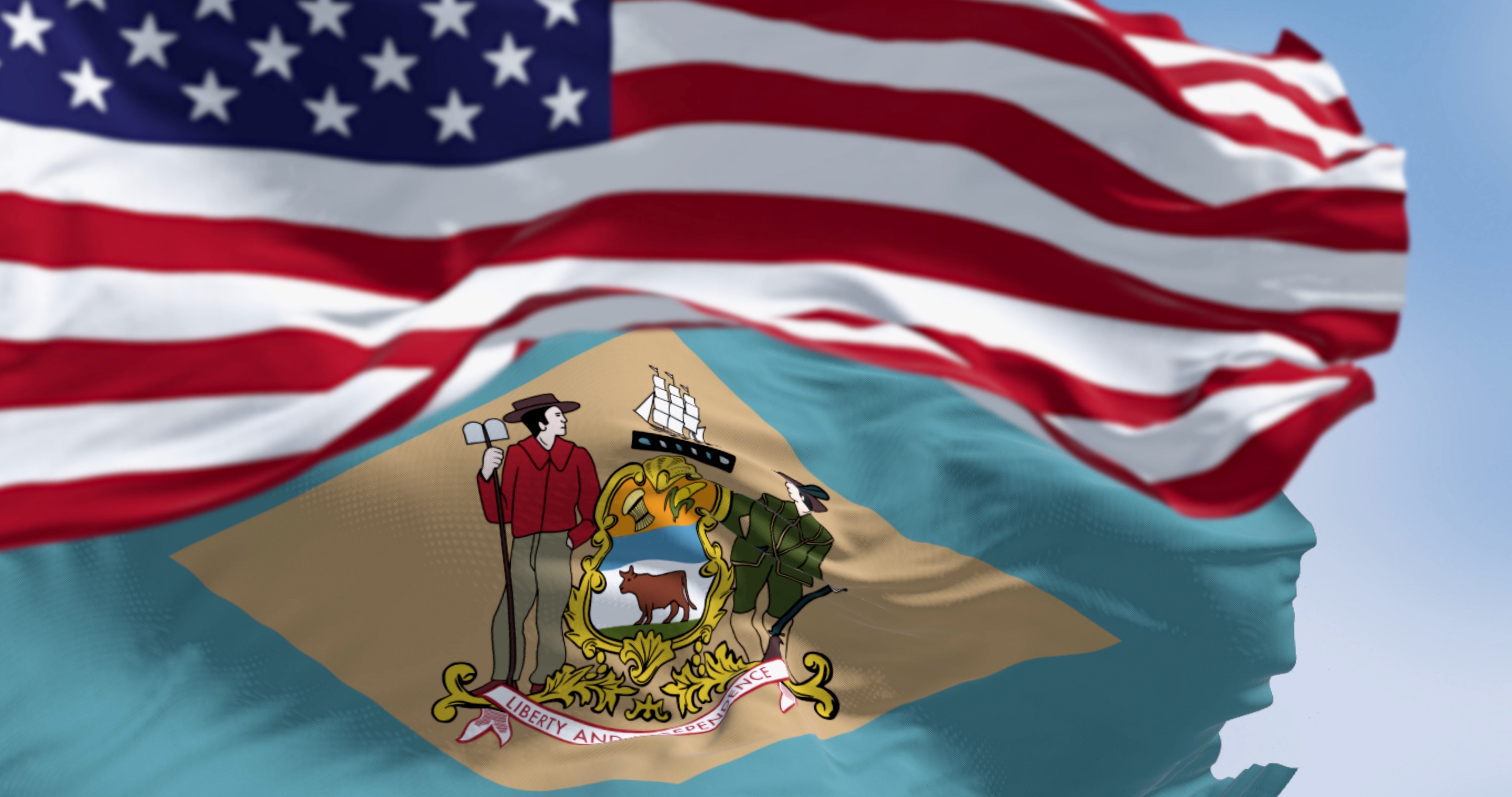 Delaware,State,Flag,Waving,With,The,National,American,Flag.,Yellowish-beige